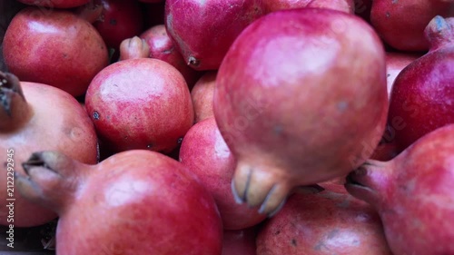 Fresh Pomegranate Falling in Slow Motion , red antioxidant rich fruits