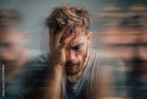 Mental health. Man experiences anxiety, emotional stress and psychological overload while motion blur symbolizes panic, burnout, depression and overwhelming thoughts.