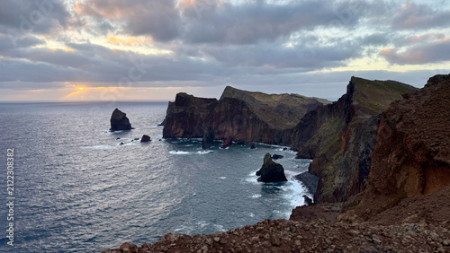 Madeira coastline at sunrise, dramatic volcanic cliffs and Atlantic Ocean, Portugal