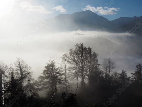 Fotografie Misty sunrise over the Apennine mountains near Rigoso, Italy.