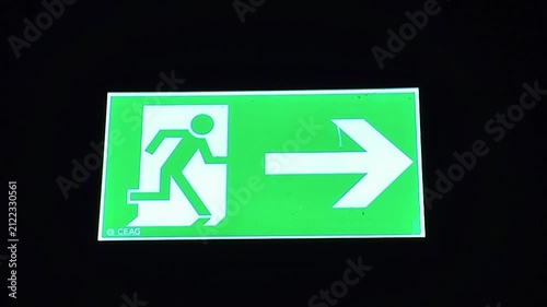 Green sign indicating direction exit helping individuals navigate and locate way