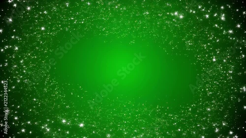 Sparkling green particles forming a glowing oval during a magical light show
