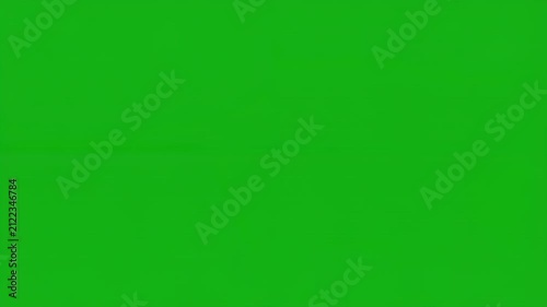 Sparkling light particles and bubbles drift across a green screen background with cinematic motion