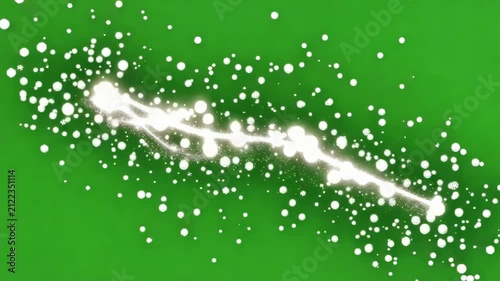 Sparkling organic particle trail swirling across green screen background with subtle depth of field effect