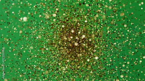 Sparkling Particles Expanding Outward From Center Against Gradient Green Background