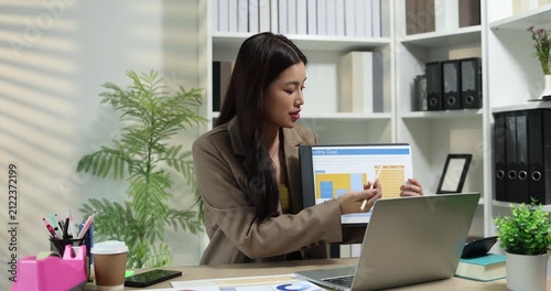 Businesswoman presenting financial reports and performance charts during business meeting, explaining data analysis, company results and strategic planning for finance, management and corporate growth