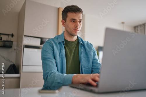 Man working on laptop at home