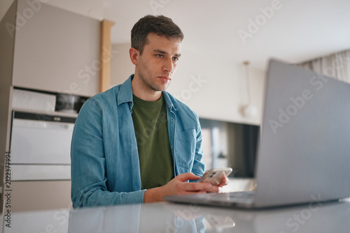 Man working on laptop at home