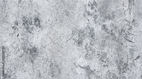 Abstract white and gray grunge stucco wall background with rough decorative texture.