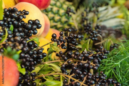 Fresh black elderberries used as natural catering table decor