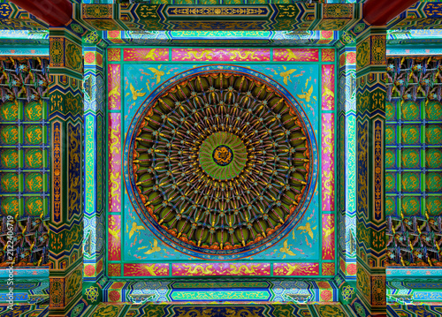 Intricate, vibrant, and ornate ceiling with traditional Chinese motifs and circular designs inside Thean Hou Temple, a beautiful landmark located in Kuala Lumpur, Malaysia