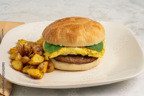 scramble egg and sausage patty  breakfast sandwich