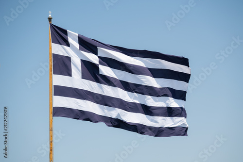 Greek flag against blue sky
