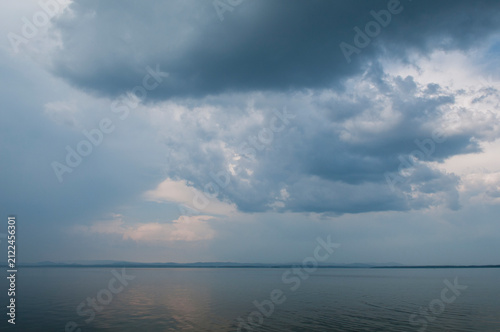 Landscape summer view of Uvildy lake with dramatic sky above, South Ural, Russia