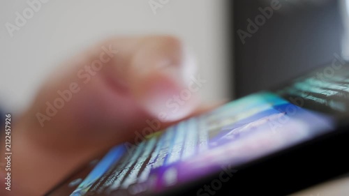Person scrolling through content on smartphone