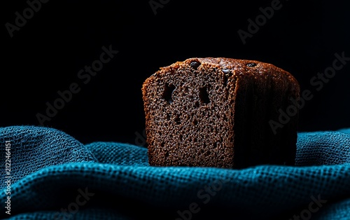 Close-up of a dark chocolate chunk cake slice