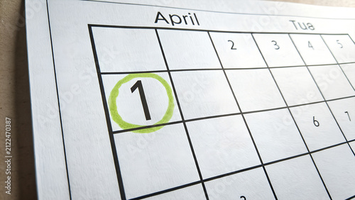 Foto April calendar page with number one circled in green calendar planning