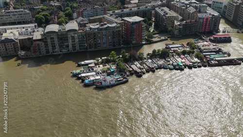 Aerial View of Houseboats Moored Along the Thames River in London During Daytime