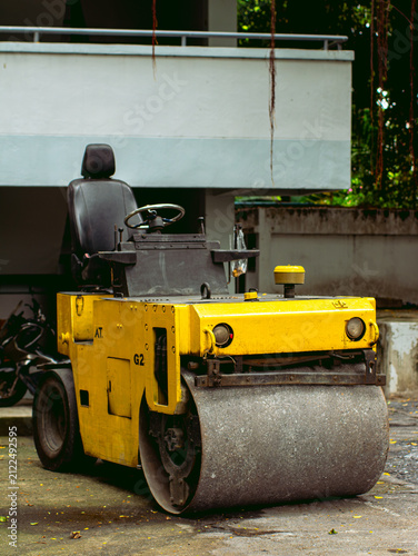 Yellow Vintage Road Roller Compactor Machine Parked Outdoor Construction Equipment