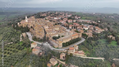 High altitude aerial flyover above the historic old town of Pienza in Tuscany Italy