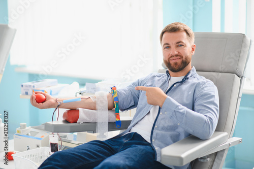 Konstfotografi Male volunteer donating blood at medical clinic