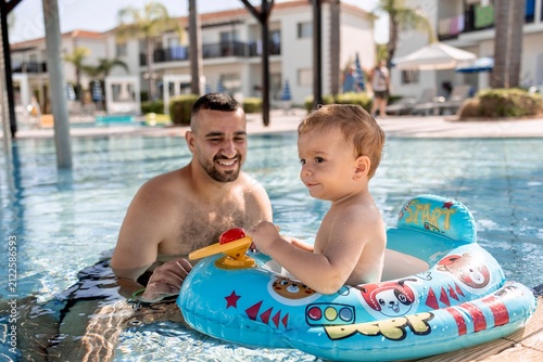 father and son in the pool