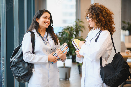 Bild auf Leinwand Medical students discussing healthcare education on campus