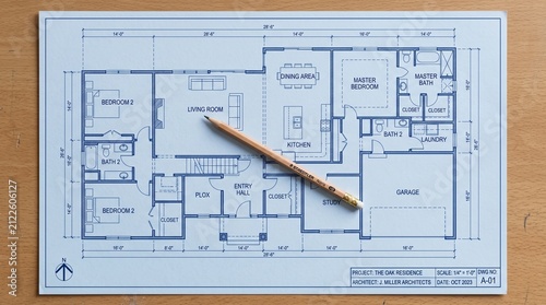 Residential architectural house floor plan blueprint with pencil on wooden table