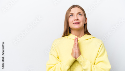 Fotografie Young Russian woman isolated on white background keeps palm together