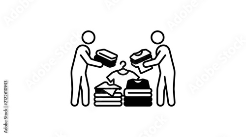 People organizing and folding laundry clothes together.