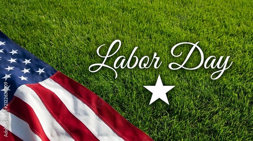 American flag resting on green grass for a festive labor day holiday celebration background image