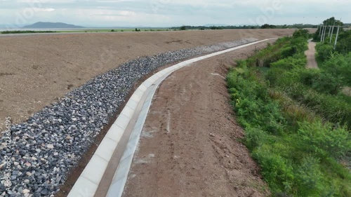 Cement canals are used to drain water from high roadsides in rural areas.