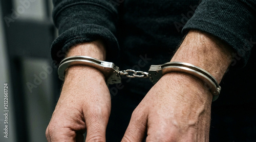 Handcuffed man, crime, justice, arrest, prison, law, security, freedom, crime scene