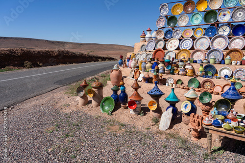 Plates, tajines and pots displayed and ready for sale at an roadside outdoor pottery marke
in Morocco.
