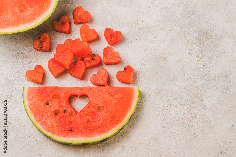 Fototapeta premium A piece of watermelon with the flesh cut out to the shape of hearts