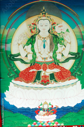 Tibetan Buddhism: Thangka of the four-armed Chenrezig on a lotus throne.