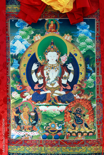 Canvastavla Tibetan Buddhism: a large thangka depicting the four-armed Chenrezig, the bodhisattva of compassion, surrounded by Amitabha, Manjusri, and the dharmapala Mahakala