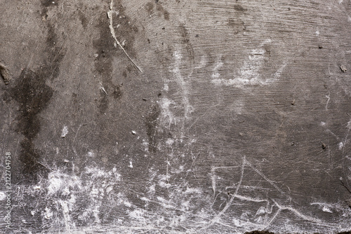 Aged rough concrete floor surface texture background with white scratches and marks