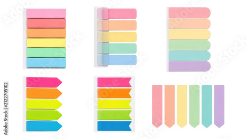 Sets of pastel adhesive sticky tabs and page flags in various shapes and colors neatly arranged on a transparent background