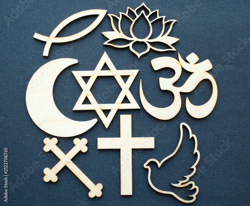 Quadro su tela A set of interfaith religious symbols carved from wood, representing faith, peace, and harmony among religions