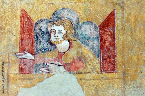 Detail of a religious mural adorning the chapel in Moutiers. Noah appears at the window of the Ark, his arms outstretched between two red shutters, 12th–13th century. Moutiers, France.