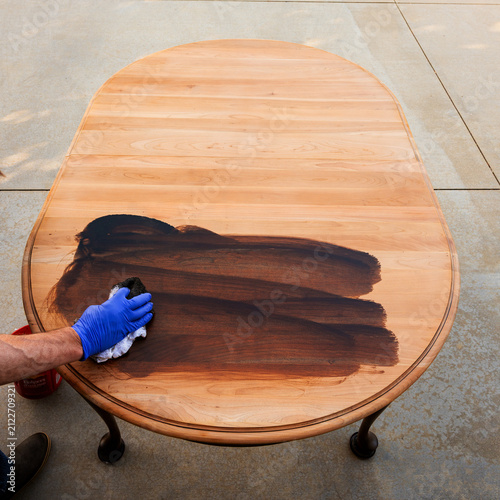 Принти на полотні Dark colored stain rubbed into a cherry wood table