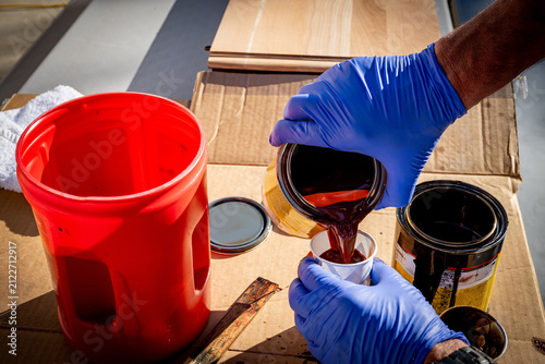 Obraz na plátne Woodworked mixes stains to achieve the right color