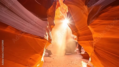 Stunning View of Slot Canyon with Sunlight Streaming Through Narrow Openings.