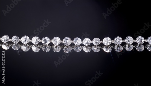a string of diamonds against black background
