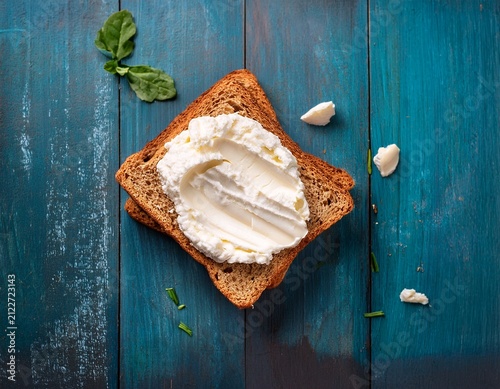 rustic flat lay of freshly baked bread cream top view cheese on white bread