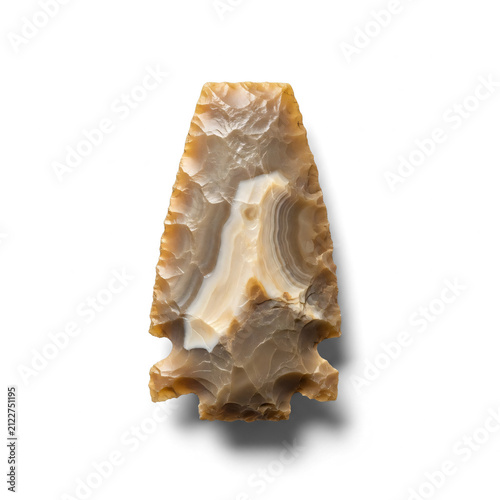 Ancient banded flint arrowhead artifact isolated on white background