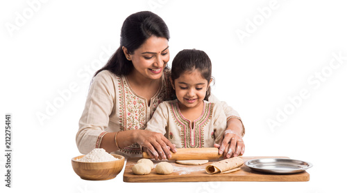 Indian mother and daughter rolling dough for roti, happy family cooking traditional food together, smiling woman teaching child to bake bread isolated PNG with Transparent Background
