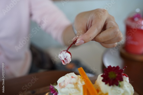 Woman Hands Writing in Notebook and Eating Delicious Ice Cream Bingsu Dessert with Spoon at Cafe, Lifestyle Working and Dessert Concept
