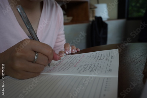 Woman Hands Writing in Notebook and Eating Delicious Ice Cream Bingsu Dessert with Spoon at Cafe, Lifestyle Working and Dessert Concept